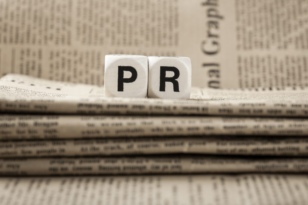 abbreviation,pr,on,newspapers,background